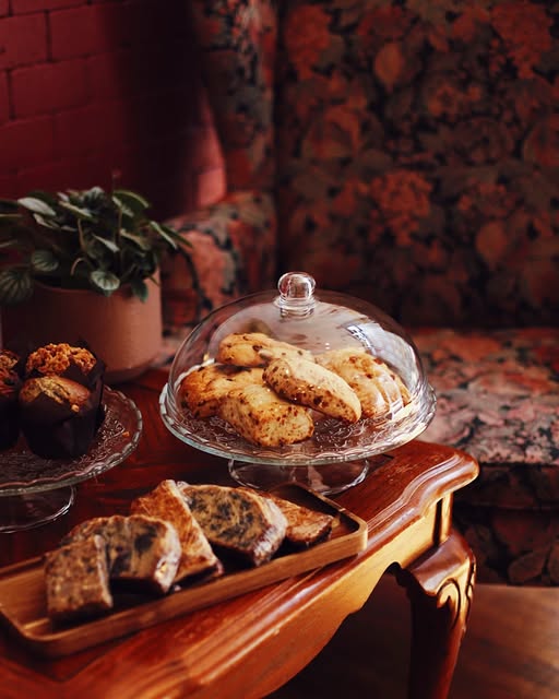 Baked goods beside a vintage chair inside the café